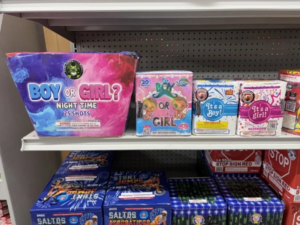 Gender reveal fireworks on the shelf at Krazy Kester's, including Boy or Girl surprise cakes and It's a Boy and It's a Girl items.